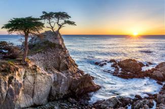 sea waves on rock formation during sunrise by Hendrik Cornelissen courtesy of Unsplash.